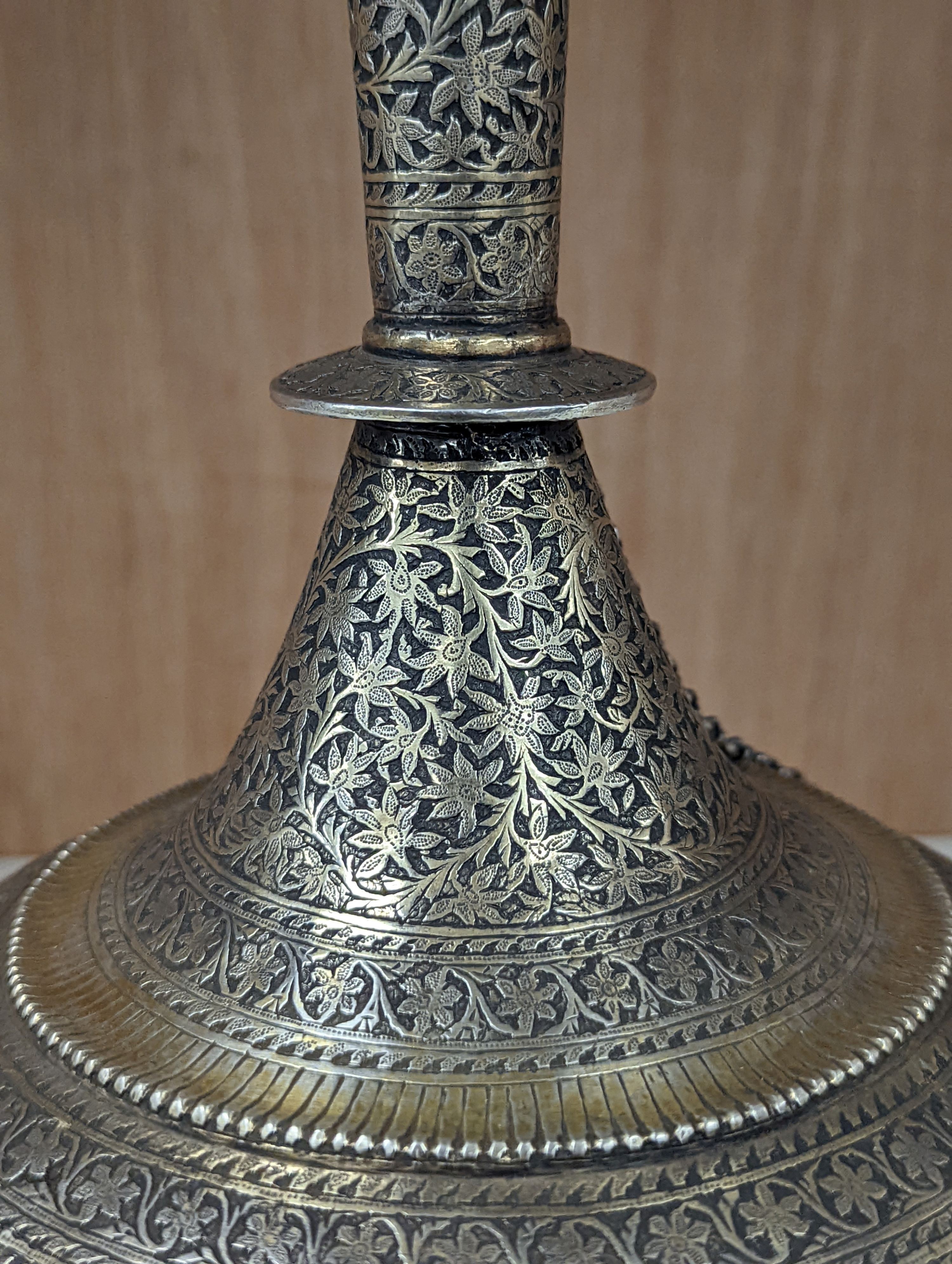 A 19th century North Indian silver surahi with engraved shawl decoration 30cm